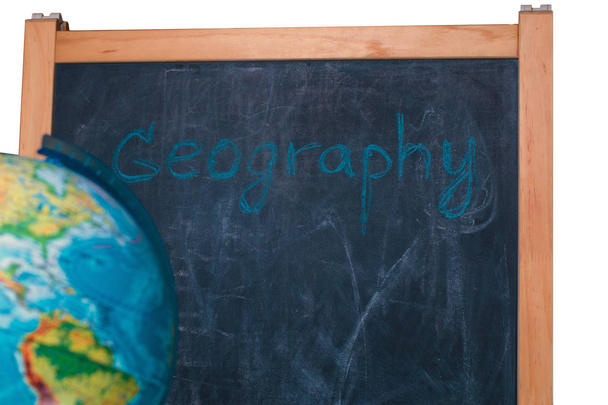 globe on the background of the school board for drawing with chalk - Foto, imagen