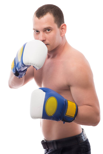 Spor adam boks eldivenleri beyaz bir arka plan üzerinde meşgul - Fotoğraf, Görsel