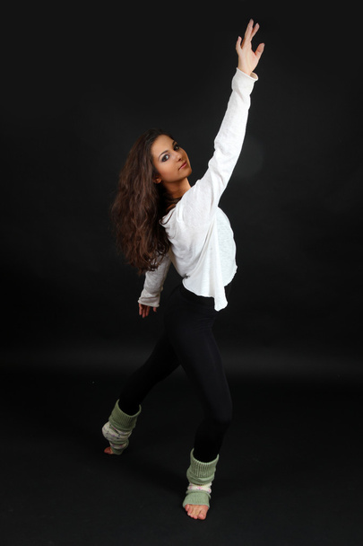 young modern dancer posing, isolated on black - Photo, Image