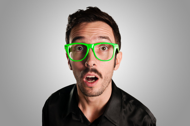 astonished man with green eyeglasses - Fotografie, Obrázek