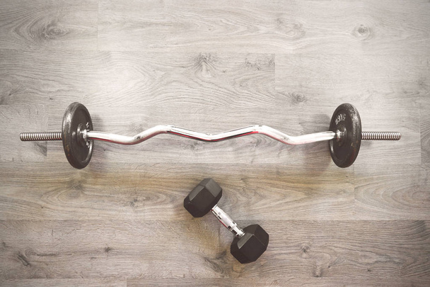Top view of barbell on floor in gym - Foto, immagini