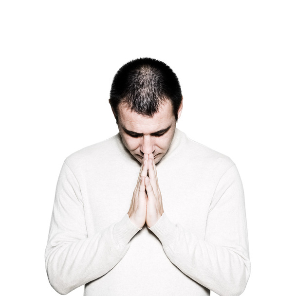 Чоловік з заплющеними руками молиться
 - Фото, зображення