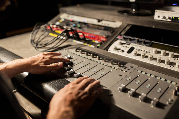 man using mixing console in music recording studio - Foto, immagini