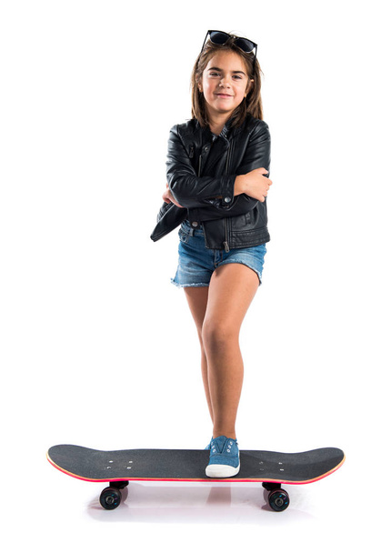 Cute brunette girl with skate - Valokuva, kuva