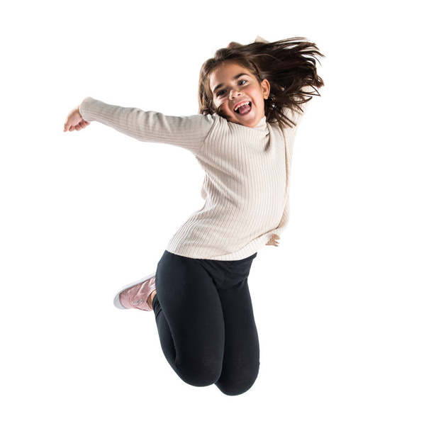 Little brunette girl jumping - Fotoğraf, Görsel