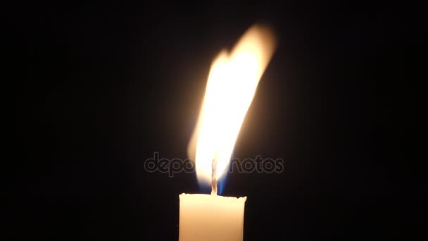 a Lit Candle Flame Blinking at Night. - Footage, Video