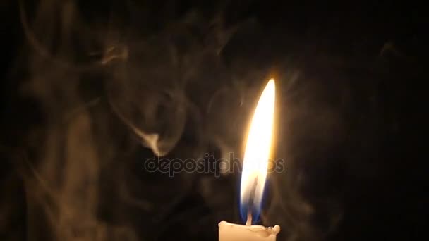 a Yellow Candle With Shimmering Light and Mysterious Smoke at Night. - Footage, Video