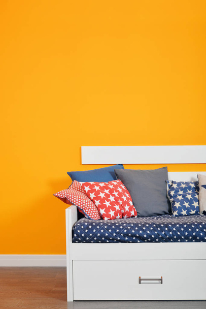 Children's bed bed with different color pillows - Fotó, kép
