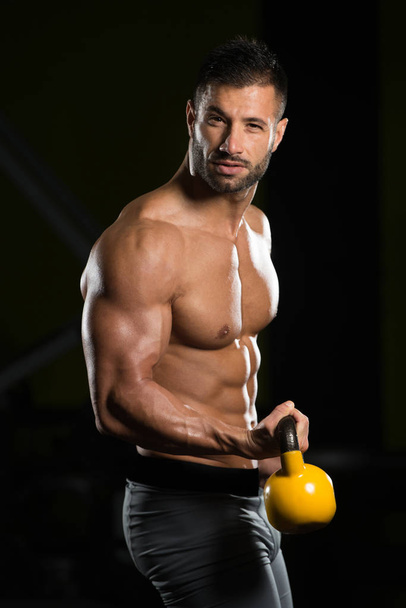 Biceps Exercise With Kettle-bell In A Gym - Fotoğraf, Görsel