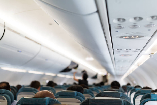 Plane cabin interior with passengers  - Photo, Image