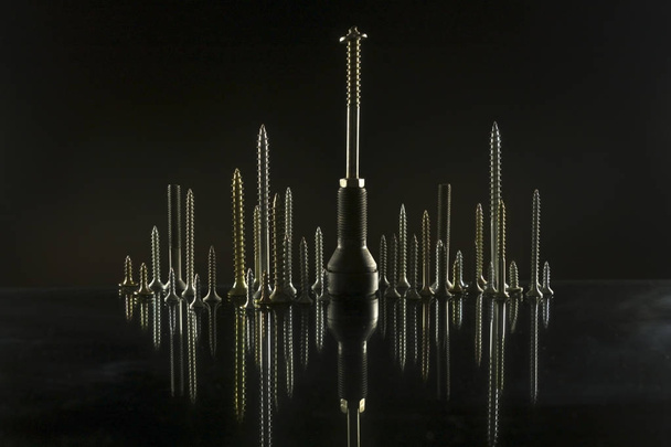     City skyline made of bolts and screws  - Photo, image