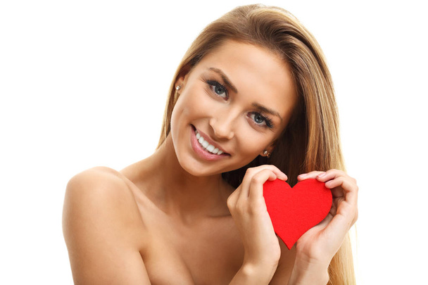 Beautiful woman posing with heart - Photo, Image