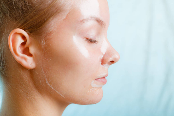 Close up woman in facial peel off mask. - Photo, image