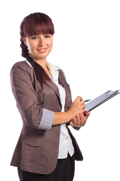 Portrait of happy business woman with clipboard and a pen - Fotó, kép