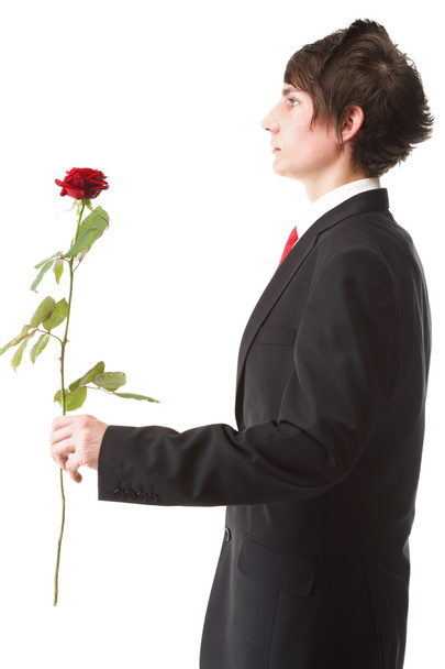 genç adam bir çiçek kırmızı sunulması izole gül - Fotoğraf, Görsel