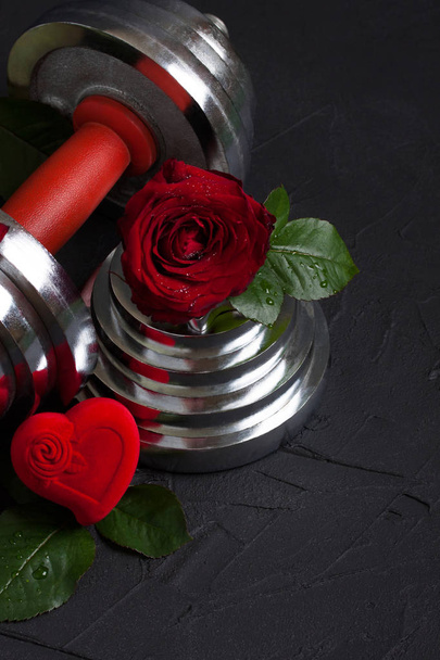 Valentines sports background with dumbbell, rose and heart box. - Photo, Image