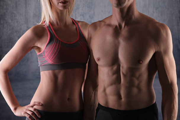 Fit couple, strong muscular man and slim woman . Sport, fitness ,workout concept. - Foto, Bild