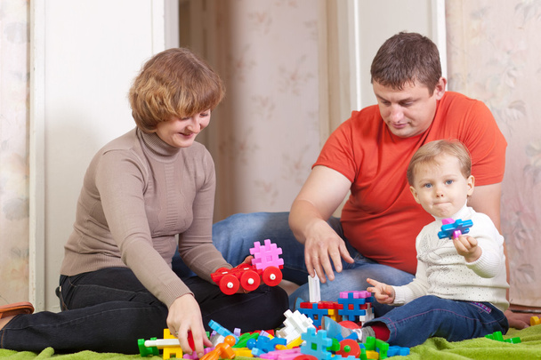 Happy family plays in home interior - Photo, image
