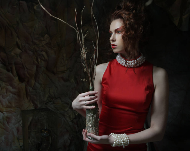 young luxury woman with bright makeup holding a bunch of dry twi - Fotografie, Obrázek