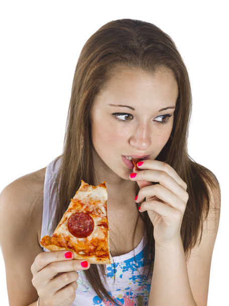 Thoughtful teenage girl eating pizza - Foto, Imagen