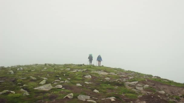 Couple of tourists climbed up to the Hoverla mountain top, Carpathians - Footage, Video