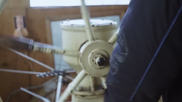 Captain turns steering wheel of ship, sharp turn - Footage, Video