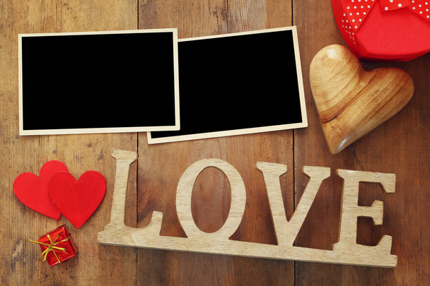 empty photo frames next word LOVE from wooden letters - Фото, зображення