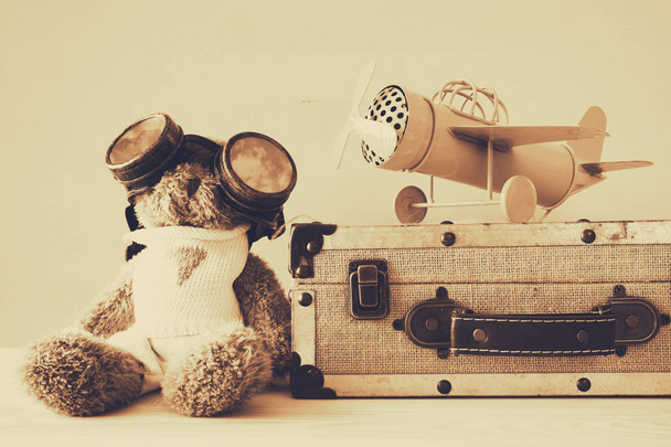 Photo of vintage toy plane and cute teddy bear - Fotoğraf, Görsel