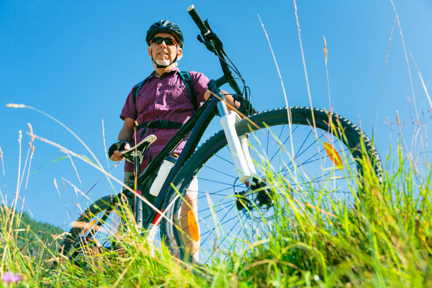 Senior With Mountain Bike Standing At Top Of A Hill - Photo, Image