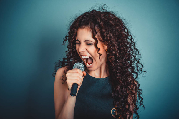 Business woman screaming / talking screaming in microphone. - Photo, Image