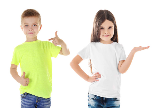 Children wearing different t-shirts on white background - Фото, изображение