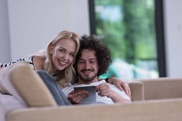 couple relaxing at  home with tablet computers - Foto, Imagem