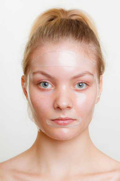 Woman in facial peel off mask. - Photo, Image