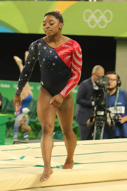 Olympic champion Simone Biles of United States competing at women's all-around gymnastics at Rio 2016 Olympic Games - Valokuva, kuva