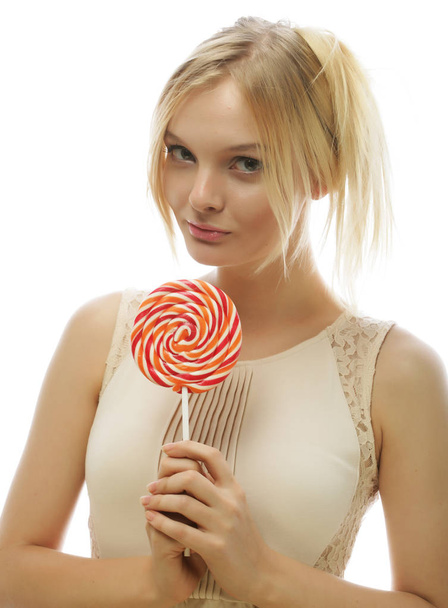 Young blond woman with candy - Photo, Image