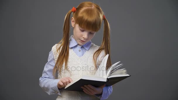 girl is reading the book - Filmati, video