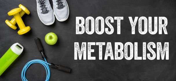 Fitness equipment on a dark background - Boost your metabolism - Photo, Image