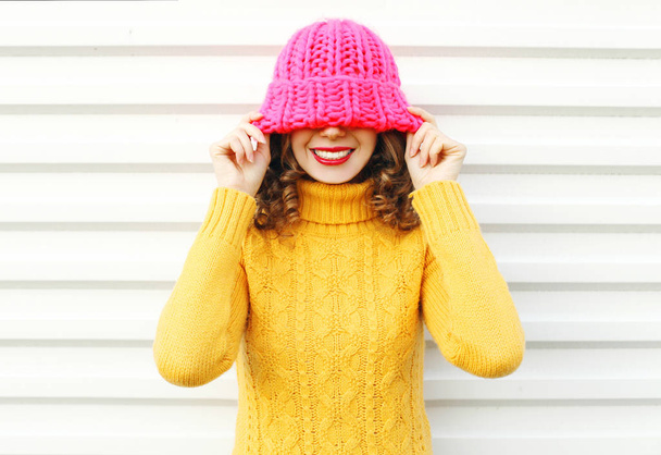 Fashion portrait happy young smiling woman wearing colorful pink - 写真・画像