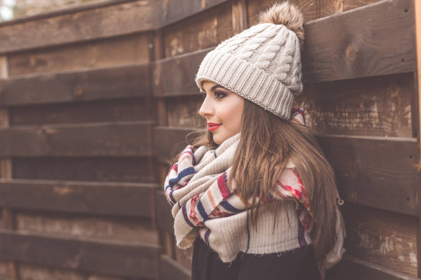 Pretty girl is wearing warm winter clothes - Foto, Imagen