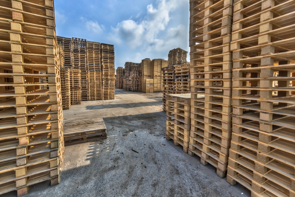 Business area with large stacks of euro cargo pallets - Photo, Image