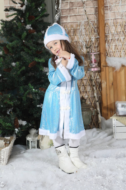 Little girl in suit snow Maiden  - Φωτογραφία, εικόνα