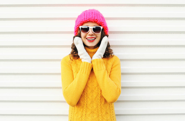 happy smiling woman having fun wearing colorful knitted pink hat - 写真・画像