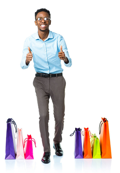 Happy african american man with shopping bags on white backgroun - Fotografie, Obrázek