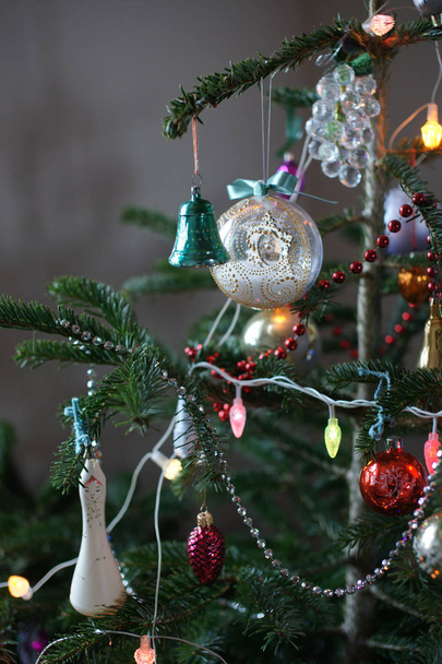 Old Soviet Christmas decorations on New Year tree. - Foto, afbeelding