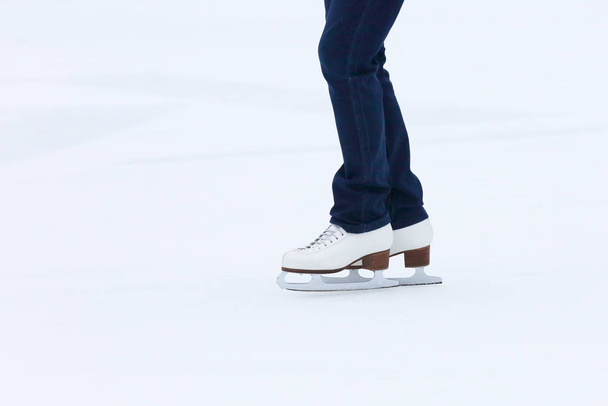 feet rolling on skates woman on the ice rink - Fotoğraf, Görsel