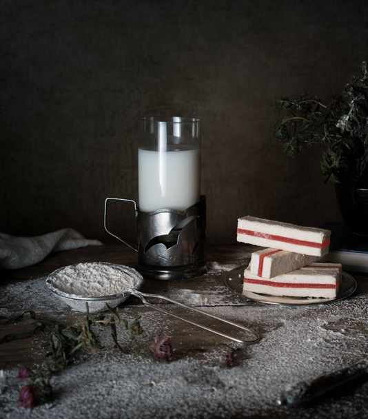 rustic still life, vintage. dark background. milk, marshmallow, meal. wooden table. - Fotoğraf, Görsel