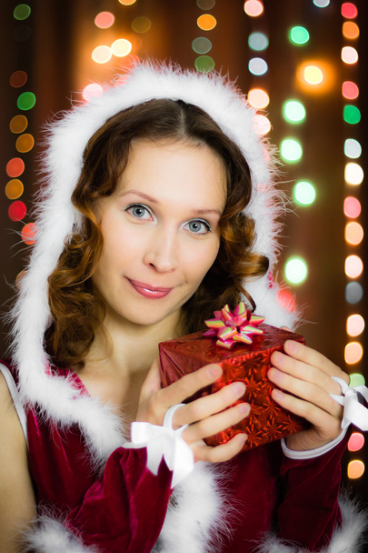 Young beautiful woman with a gift - Fotoğraf, Görsel