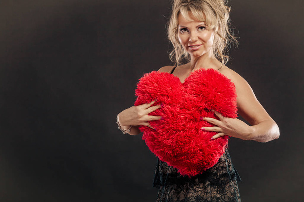 Mature woman hug big red heart  - Foto, Imagem