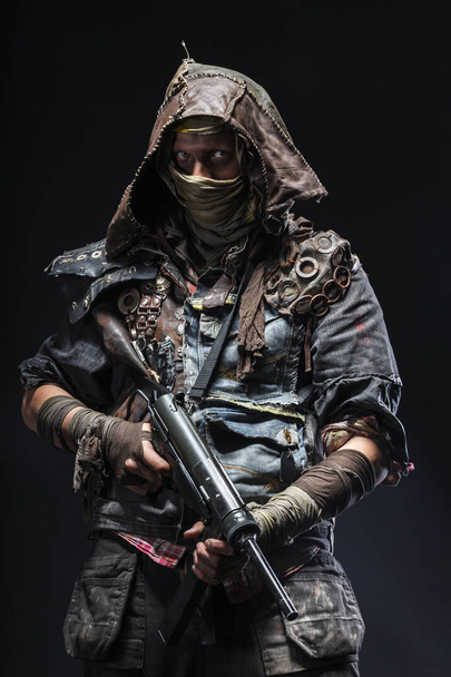 Grimy survivor with homemade weapons - Photo, Image