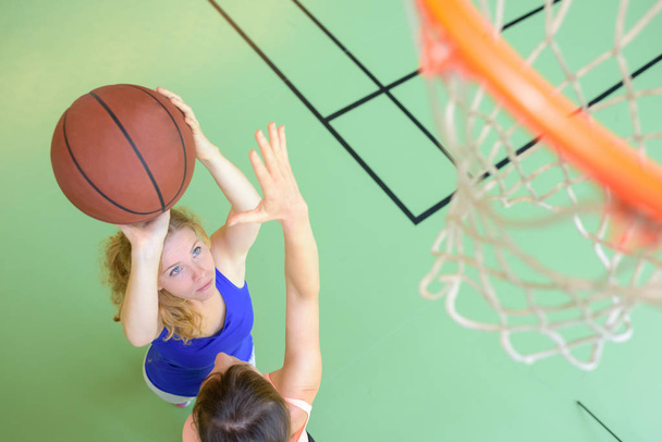 woman playing basketball and play - Foto, Imagen